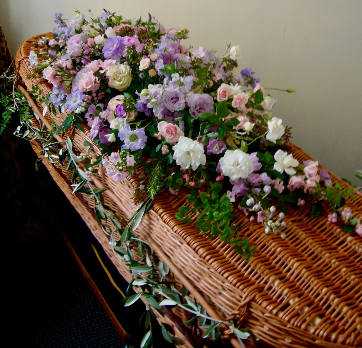 White coffin spray of funeral flowers by Pulbrook & Gould, London