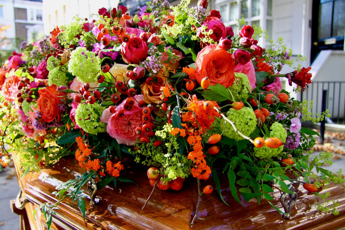 Elegant coffin spray arrangement by Pulbrook & Gould, London
