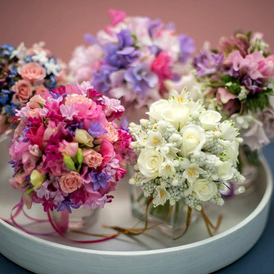 
                    
                      Bridal Bouquets Class by Pulbrook Gould bouquet-making class workshop experience with pastel pink and purple blooms
                    
                  