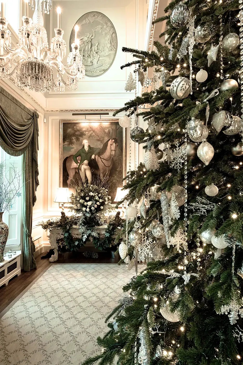 Silver and white Christmas tree and mantel floral display in an elegant London drawing room by Pulbrook & Gould