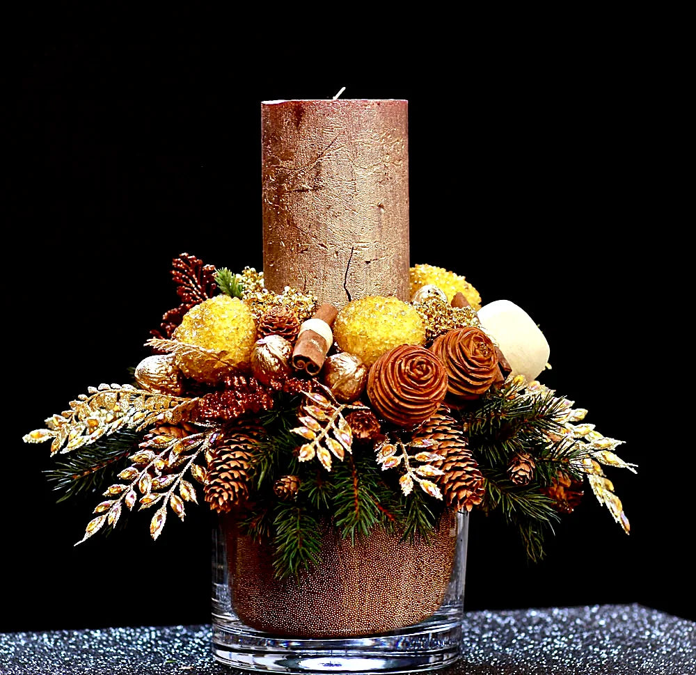 Gold Christmas candle centrepiece with pinecones and gilded foliage by Pulbrook & Gould