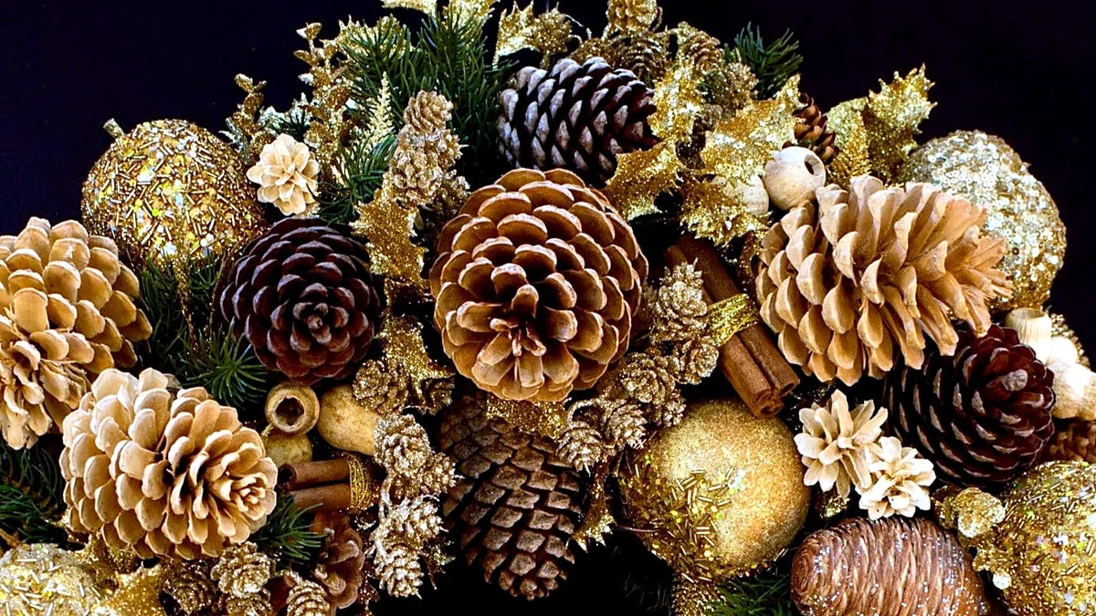 Close-up of a gold and pinecone Christmas garland by Pulbrook & Gould