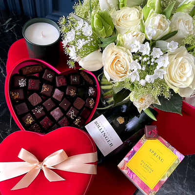 
                    
                      Constance Gift Set by Pulbrook and Gould gift set hamper for London delivery with red heart chocolates, roses and candle
                    
                  
