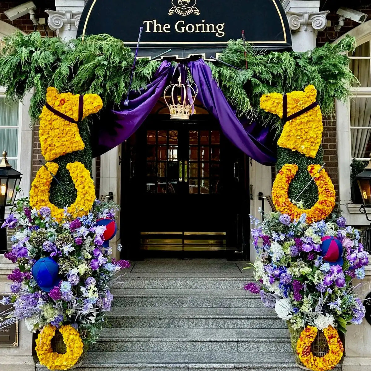 Coronation-themed floral horseshoe display at The Goring hotel entrance by Pulbrook & Gould