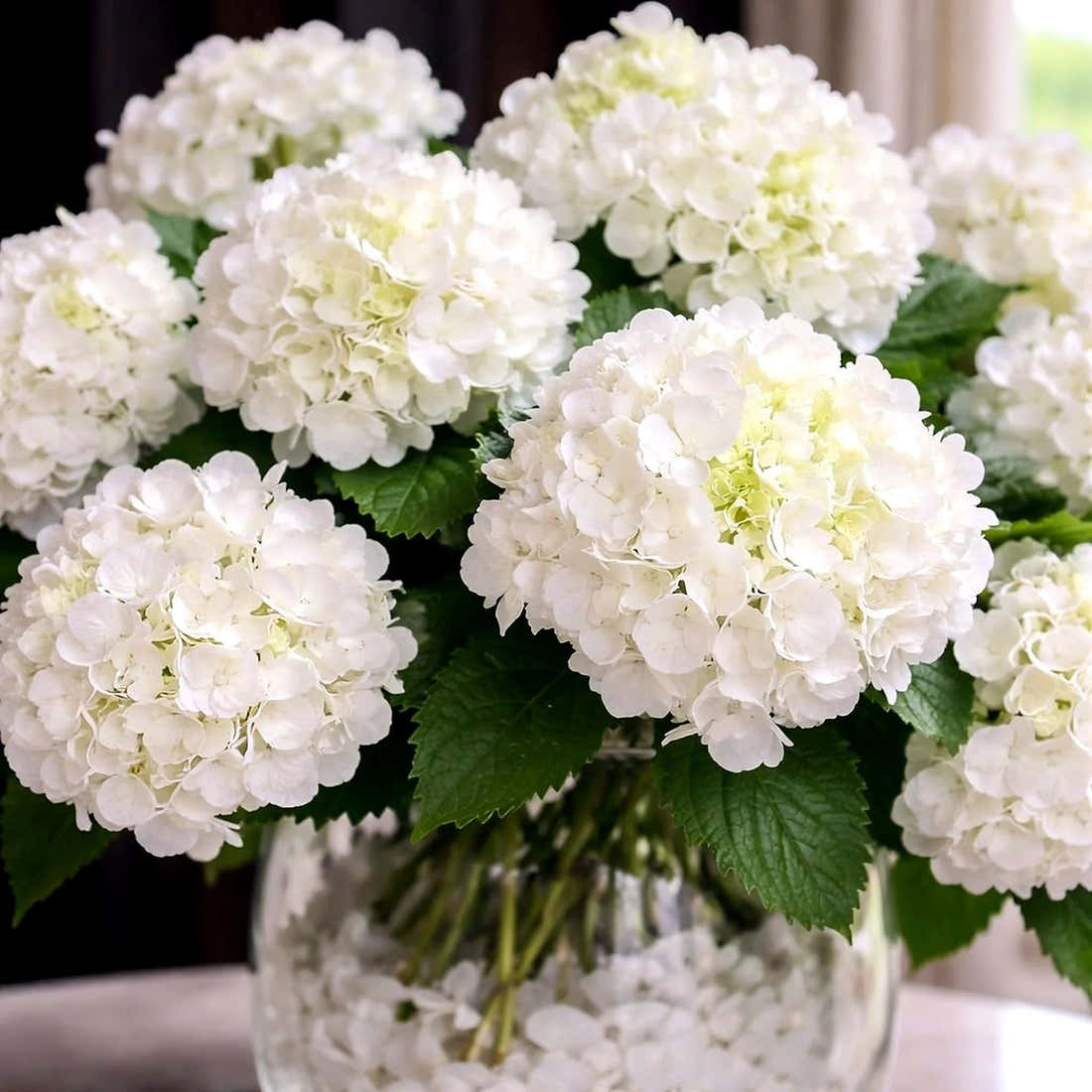 Large Faux White Hydrangea Arrangement by Pulbrook Gould in glass vessel with selenite accents