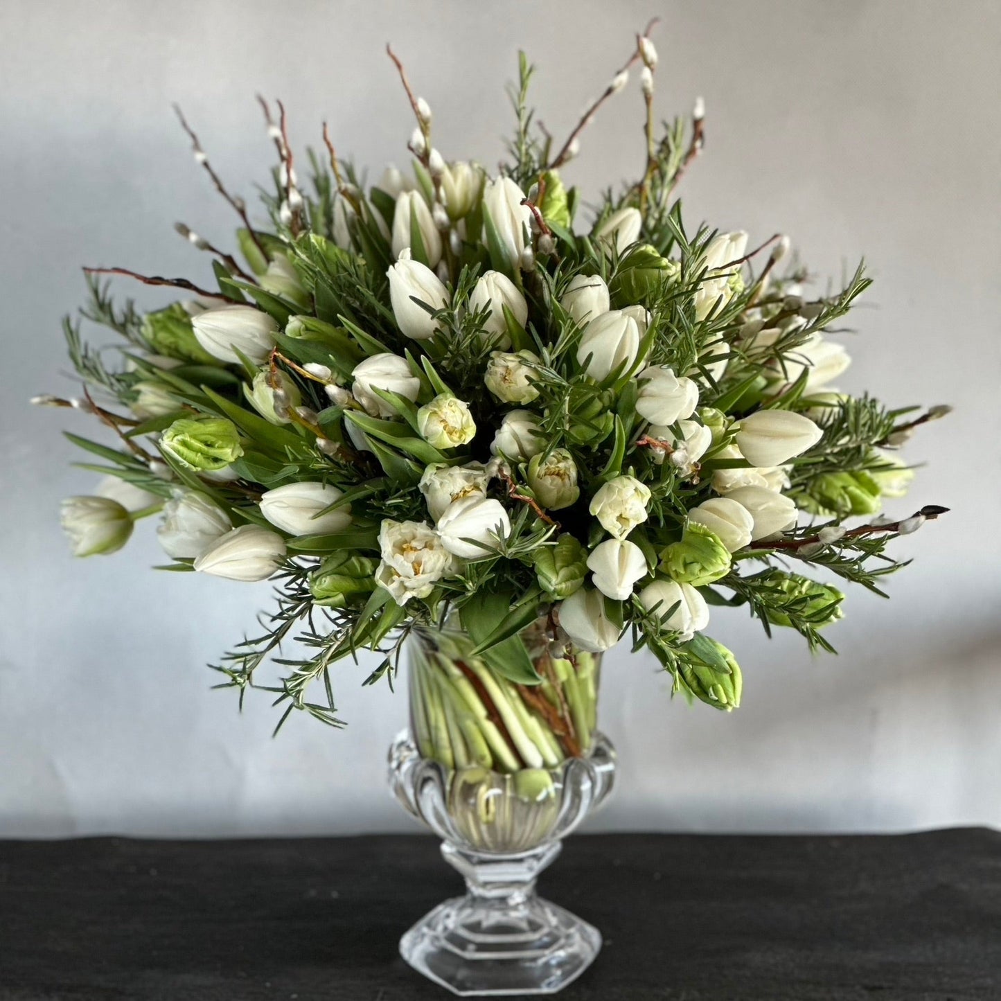 Margaret Mother's Day bouquet by Pulbrook & Gould — white tulips with fresh green foliage in signature wrapping
