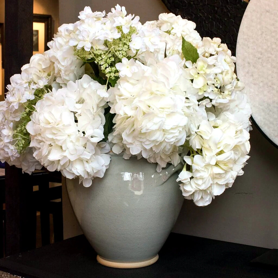 Mixed White Hydrangea Arrangement by Pulbrook Gould faux flower arrangement in ceramic pot with silk hydrangea blooms