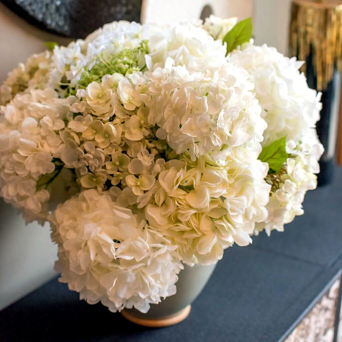 Mixed White Hydrangea Arrangement by Pulbrook and Gould in a faux flower arrangement ceramic pot