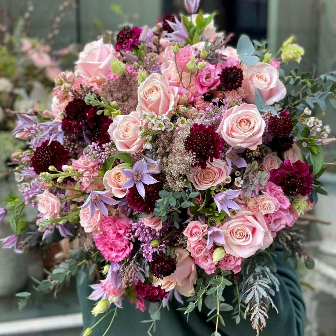 Radiant Pastels Pulbrook Gould hand-tied bouquet in soft pink and burgundy with rose and scabiosa mix