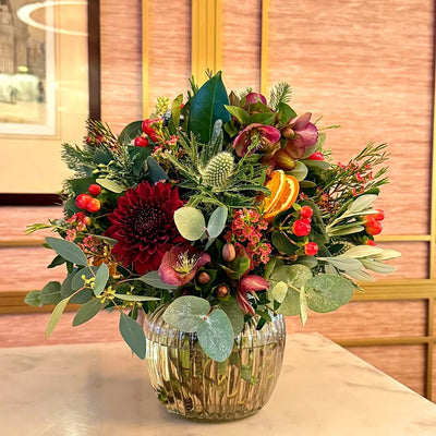 
                    
                      Seasonal Vase Arrangement Class by Pulbrook and Gould, flower arranging class experience in a gold glass vase
                    
                  
