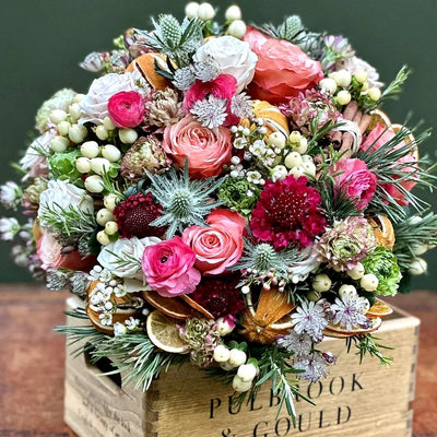 
                    
                      Seasonal Vase Arrangement Class by Pulbrook Gould flower arranging class experience with pink and red blooms
                    
                  