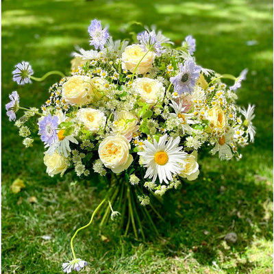 
                    
                      Summer Breeze Pulbrook and Gould hand tied bouquet with fresh cut yellow roses, daisies and lavender flowers
                    
                  
