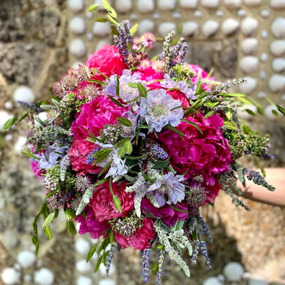 
                    
                      Summer Brights by Pulbrook and Gould hand tied bouquet with pink roses, lavender sprigs and pale lilac blooms
                    
                  