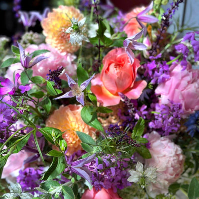 
                    
                      Summer Enchantment by Pulbrook Gould vase arrangement with orange dahlias, pink roses and purple nigella
                    
                  