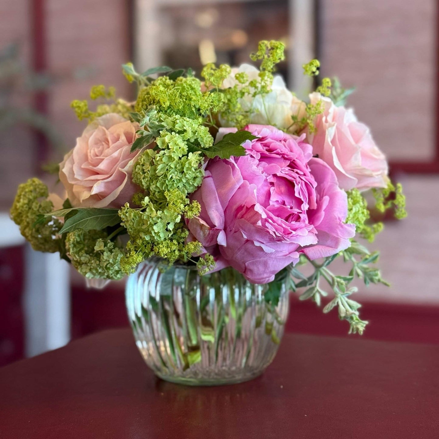 Summer Mornings Posy with pink peony, peach roses and alchemilla by Pulbrook & Gould London