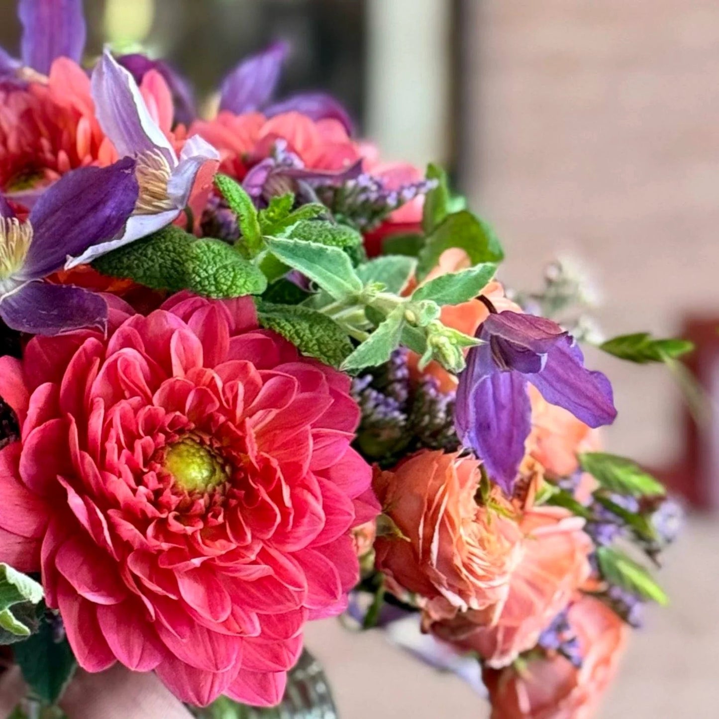 Summer Thrills Posy by Pulbrook and Gould fresh-cut floral posy bouquet in pink and purple with green foliage