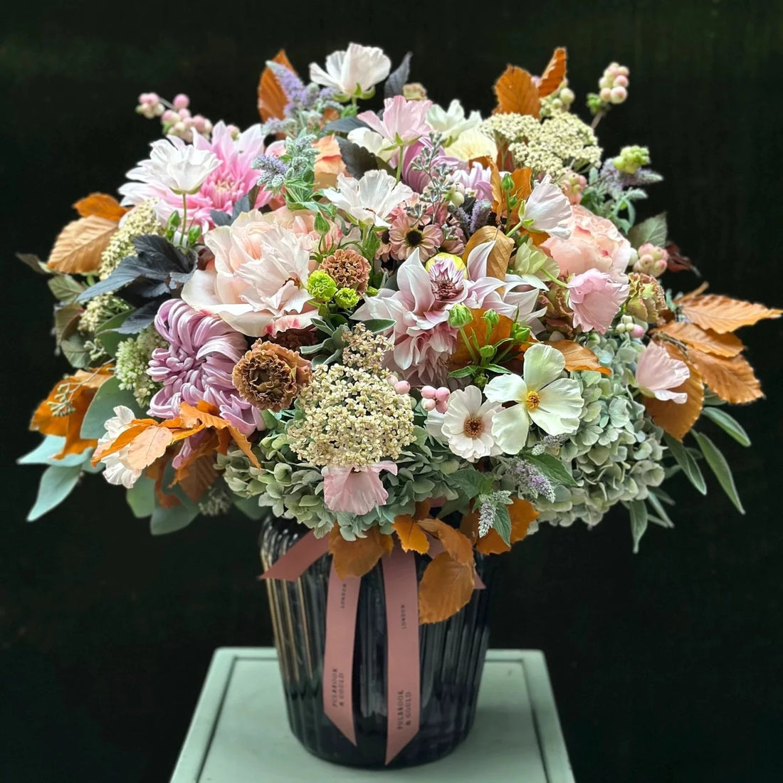 The Albany by Pulbrook and Gould hand tied bouquet and vase arrangement in pastel pink and white with mint sprigs