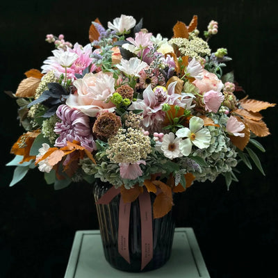 
                    
                      The Albany by Pulbrook Gould hand-tied bouquet and vase arrangement with pastel pink and cream blooms
                    
                  