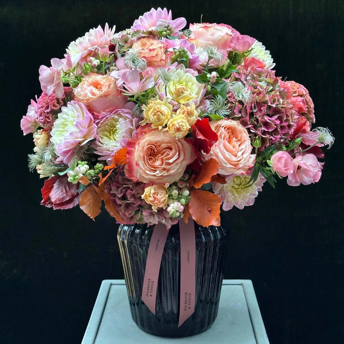 The Beaufort by Pulbrook and Gould hand-tied bouquet and vase arrangement in pink and cream with autumn foliage