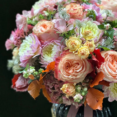 
                    
                      The Beaufort by Pulbrook and Gould hand tied bouquet and vase arrangement in soft pink and yellow with seasonal foliage
                    
                  