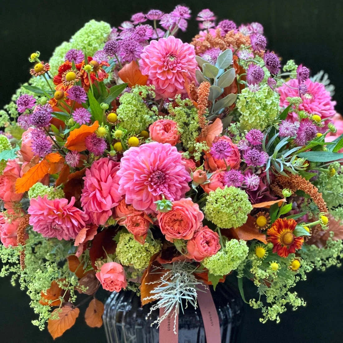 The Kent by Pulbrook and Gould hand tied bouquet with pink, purple and orange mixed flowers