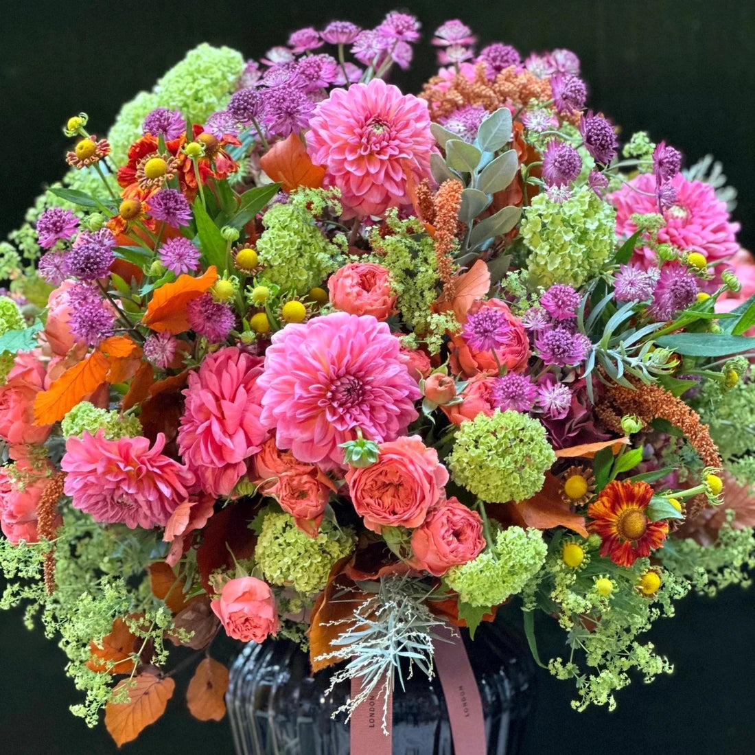 The Kent by Pulbrook and Gould hand tied bouquet with pink, purple and orange mixed flowers