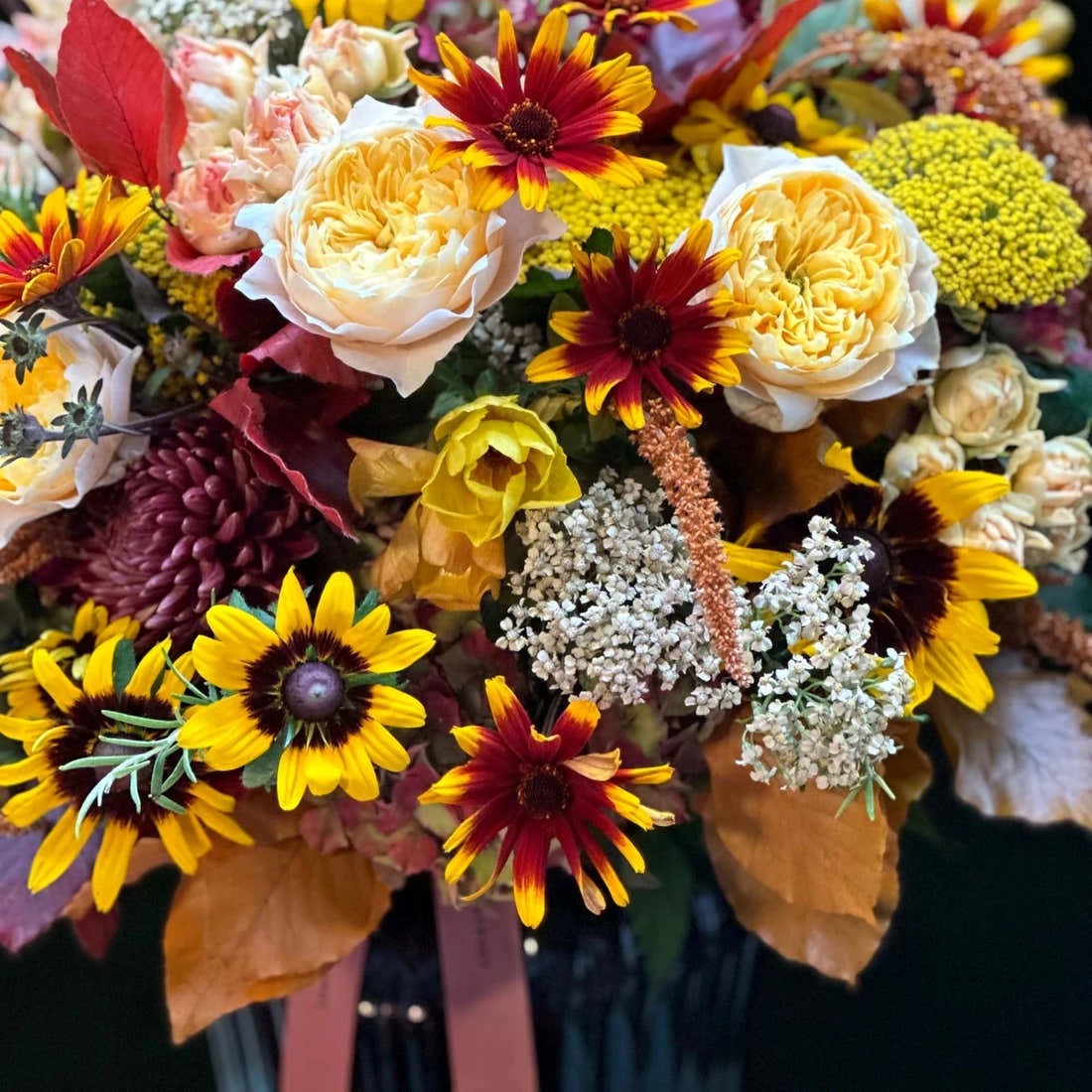 The Windsor by Pulbrook and Gould hand-tied bouquet arrangement with autumn flowers in warm yellow and red