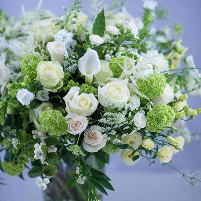 
                    
                      Timeless Whites by Pulbrook and Gould hand-tied bouquet in white with roses, calla lilies and lisianthus
                    
                  