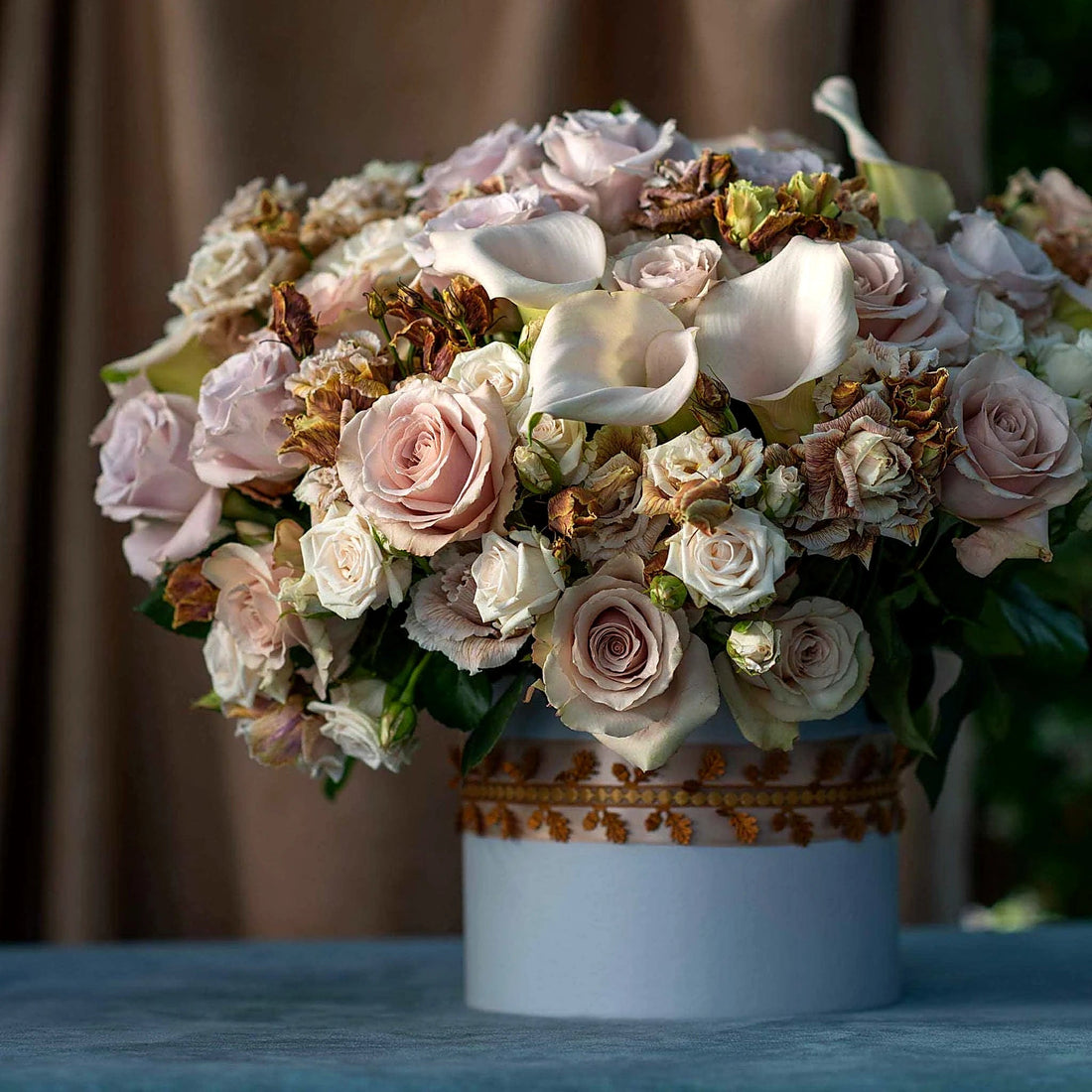 Vintage Hatbox by Pulbrook Gould floral hatbox arrangement with pale pink roses and champagne roses