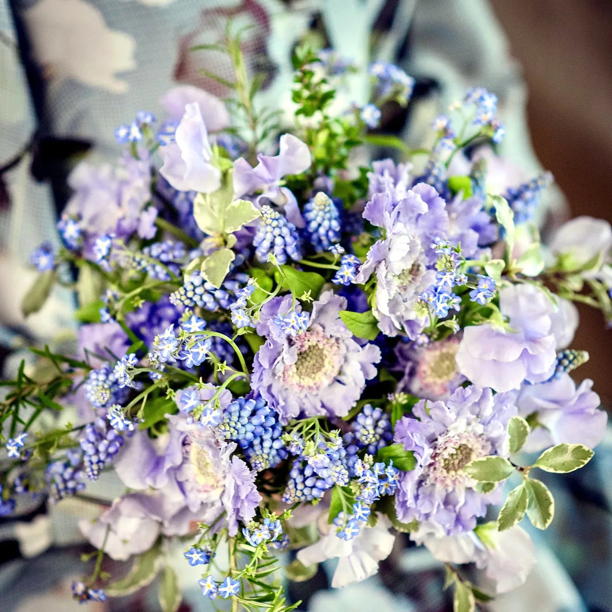 Lilac and blue bridal bouquet with scabiosa and grape hyacinth by Pulbrook & Gould