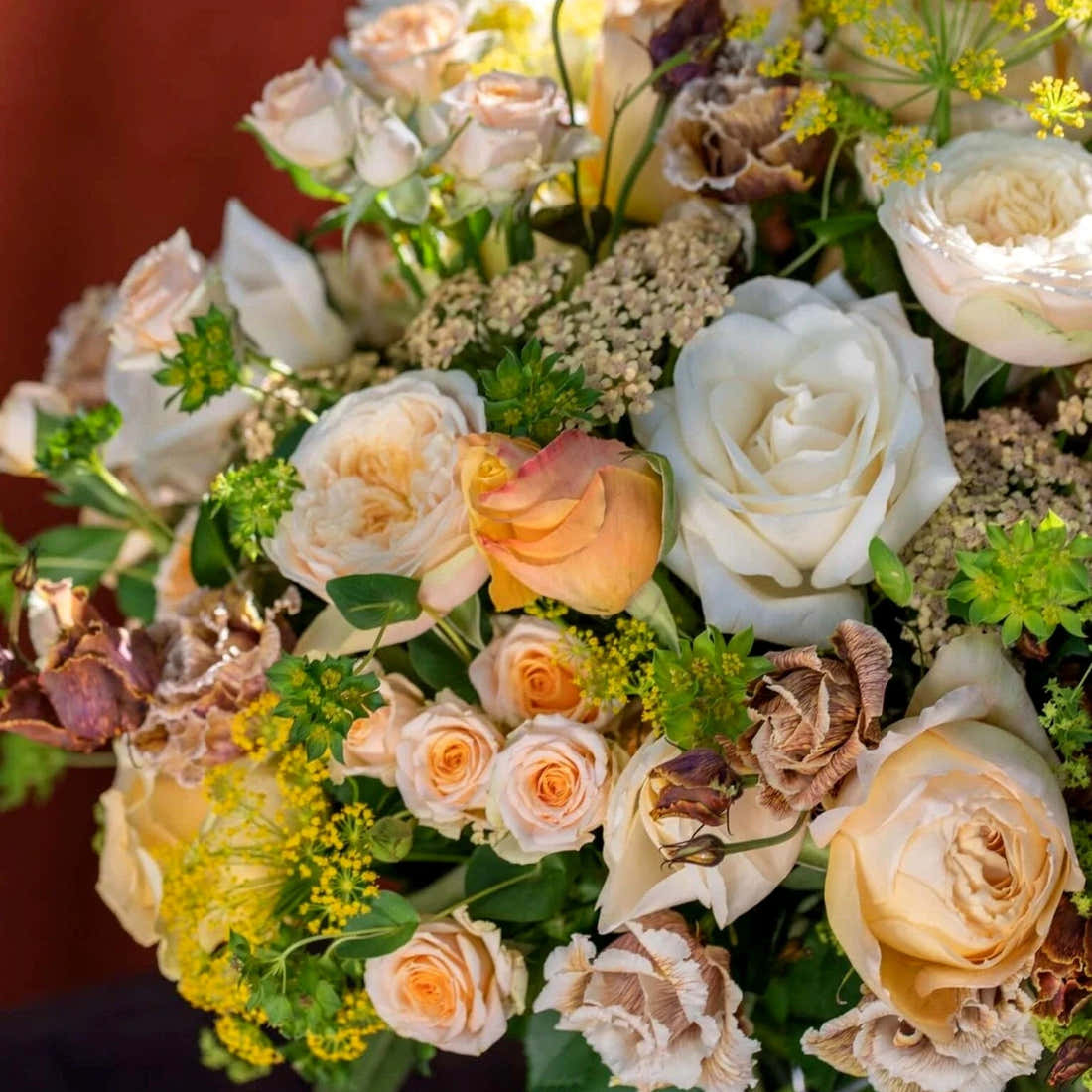 White and Peach Floral Harmony by Pulbrook Gould hand-tied bouquet and vase arrangement with roses and astrantia