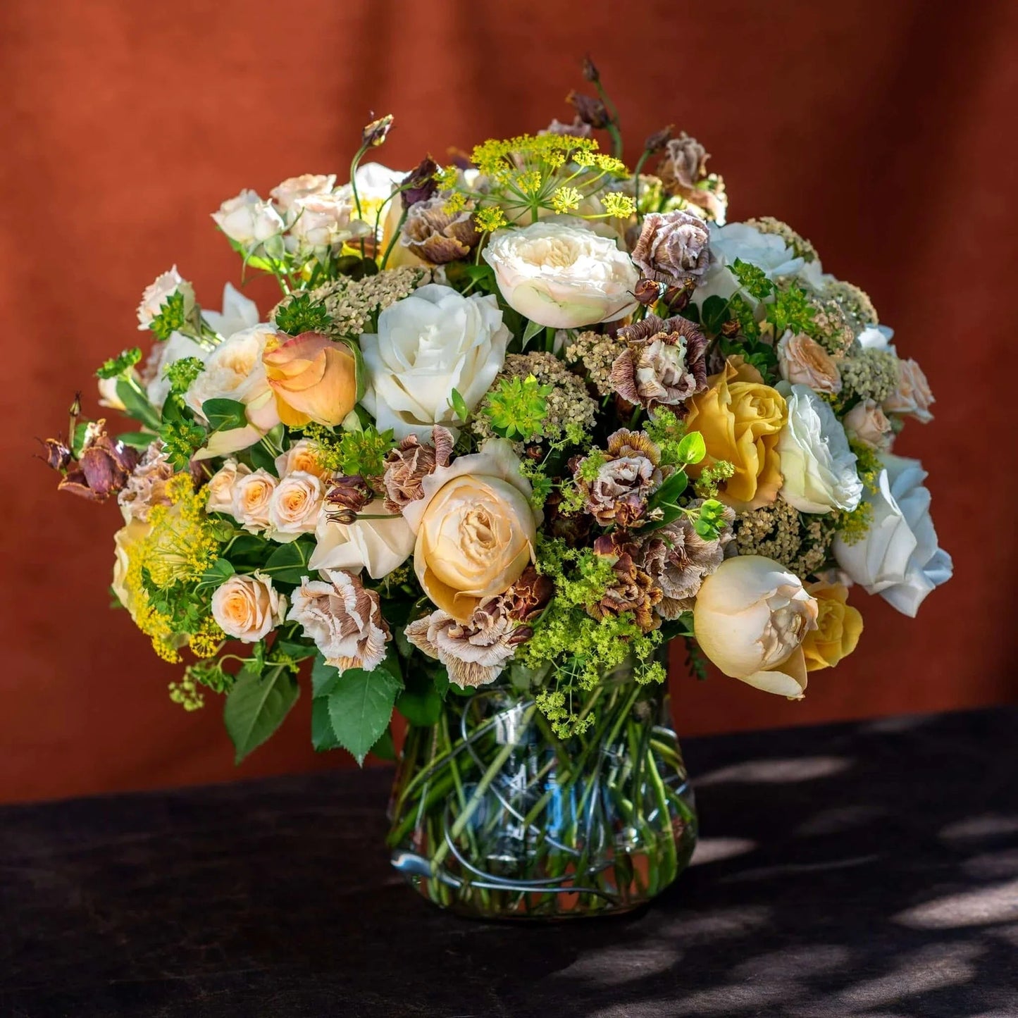 White and Peach Floral Harmony by Pulbrook Gould hand tied bouquet in soft white and peach with roses and astrantia
