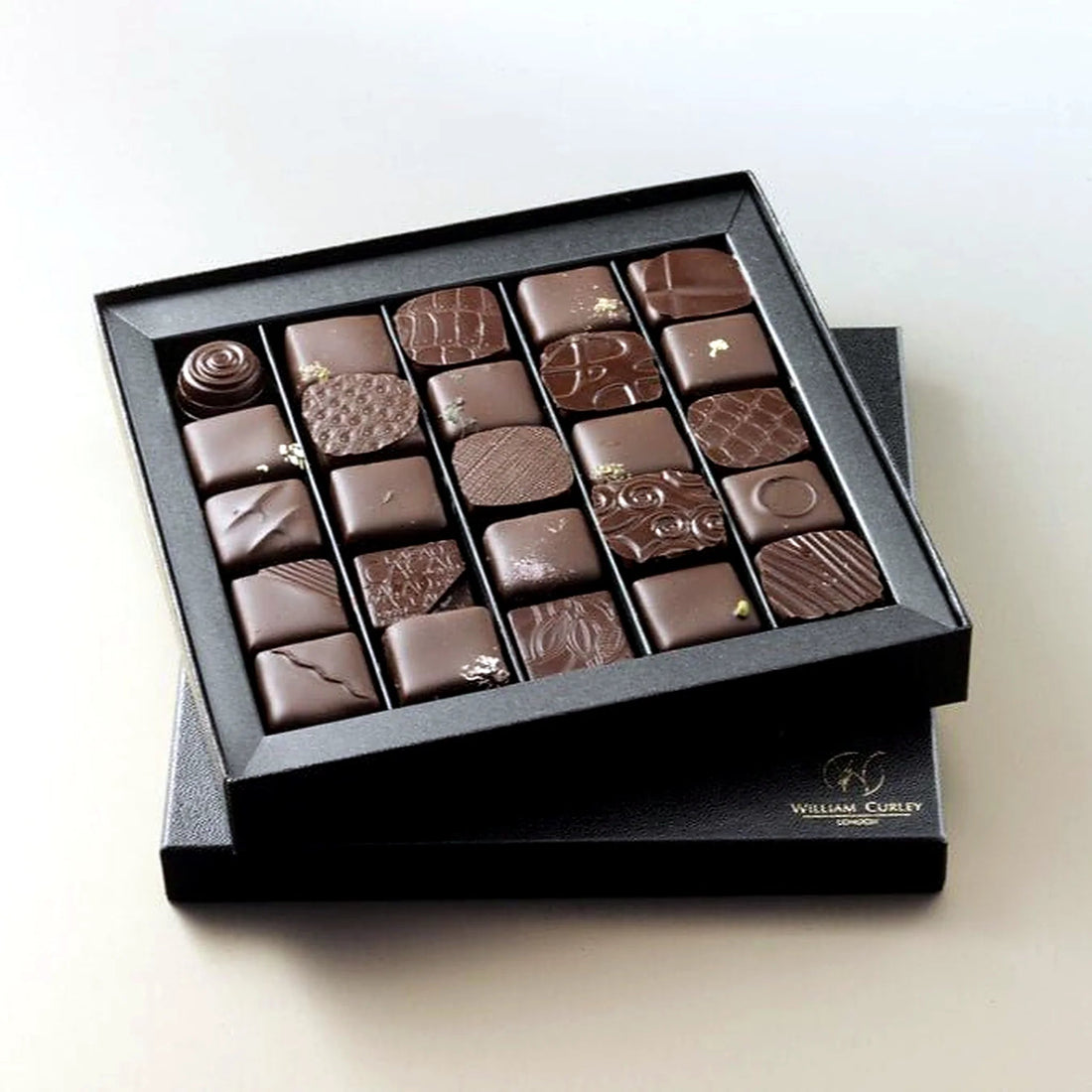 William Curley Handmade Chocolates 25 Piece by Pulbrook and Gould, 25-piece chocolate gift box in dark and milk tones