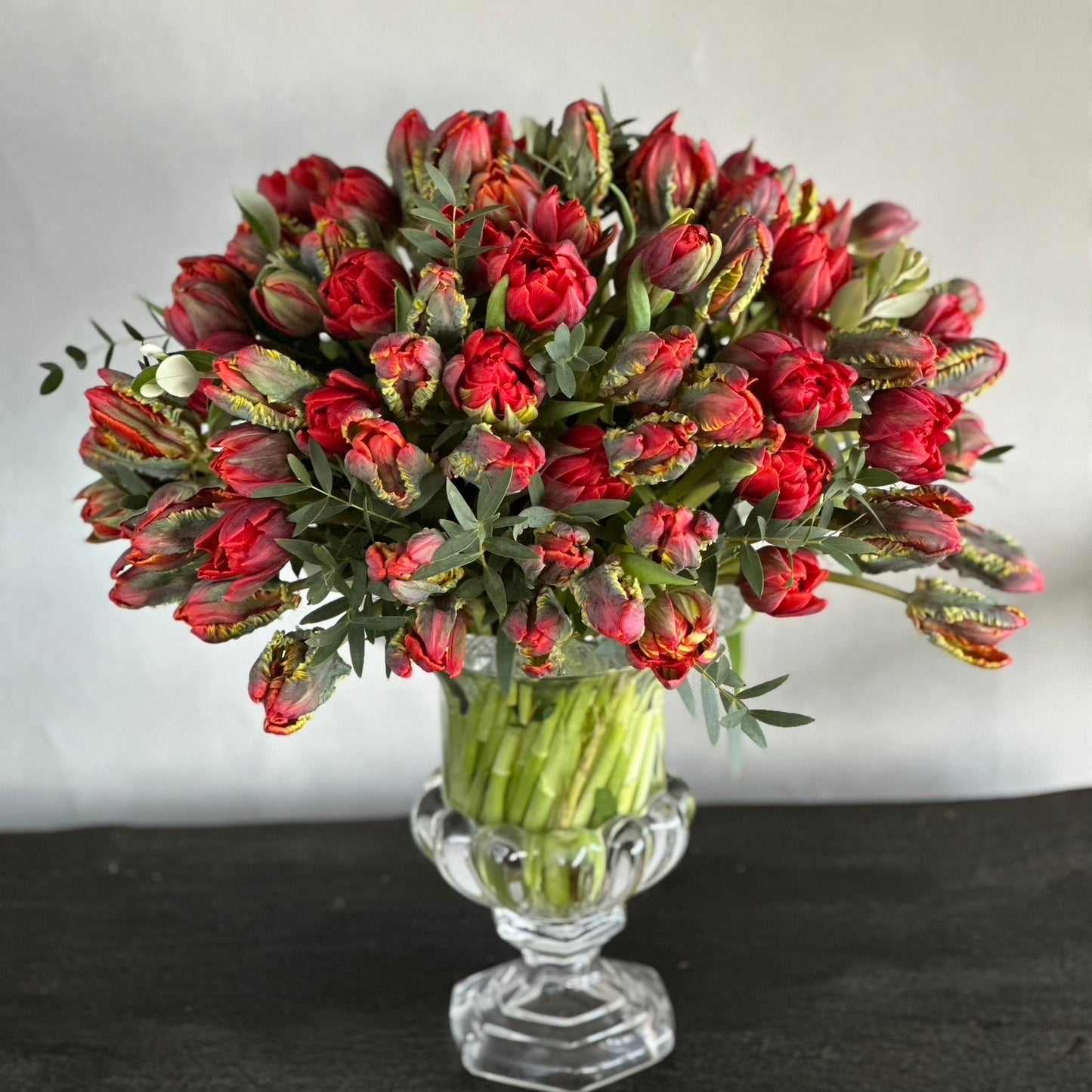 Eva Mother's Day bouquet by Pulbrook & Gould — bold red tulips hand-tied in signature spring wrapping