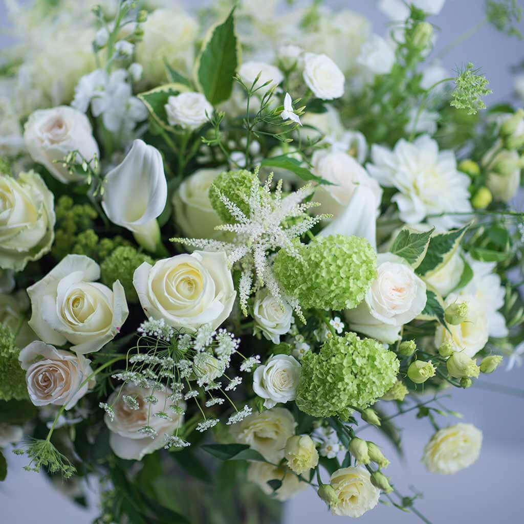 Luxury white flower bouquet with roses and calla lilies