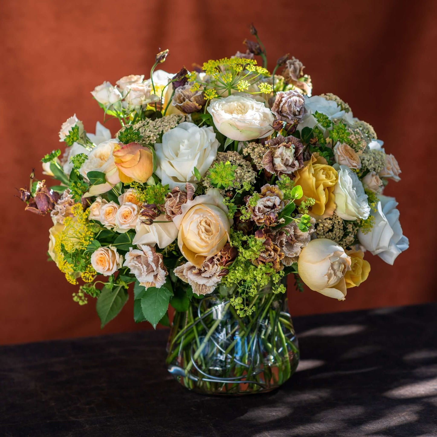 White and Peach Floral Harmony Mother's Day bouquet by Pulbrook & Gould — white and peach roses with astrantia in a clear glass vase